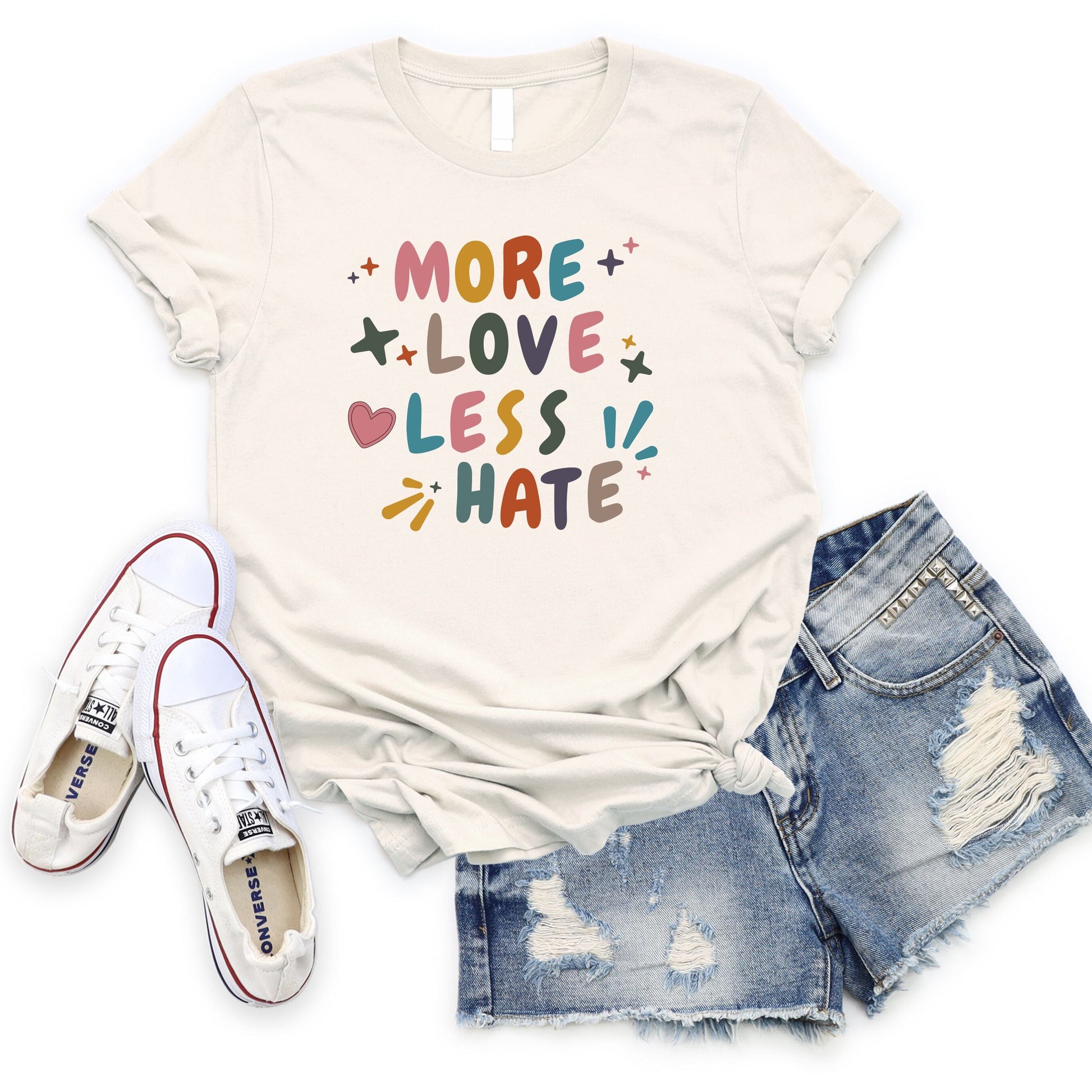 More Love Less Hate T-Shirt Flat Lay in Natural